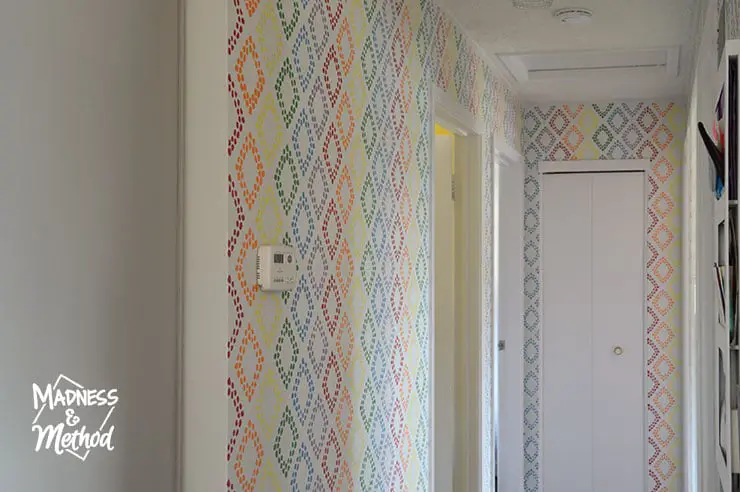 subtle rainbow hallway with white doors