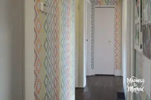rainbow diamond walls in white hallway