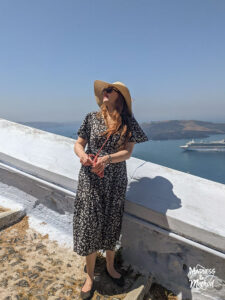 girl walking to santorini old port