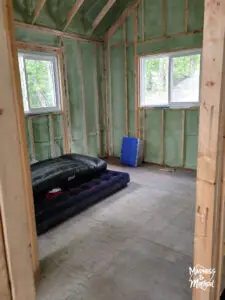 upstairs bedroom framing with air mattress on floor
