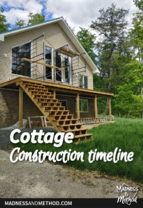 cottage construction timeline text overlay with two level cottage and big windows