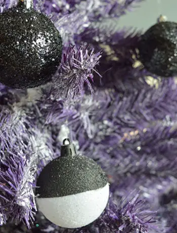 black and white christmas balls on purple tree