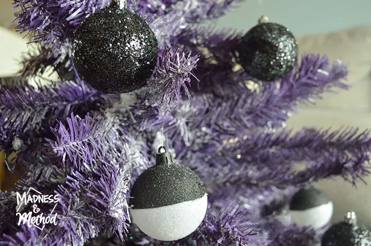 black and white christmas balls on purple tree