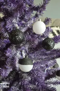 black and white christmas balls in purple tree