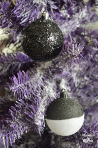 purple christmas tree with black and white balls