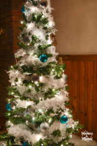 christmas tree with lights in basement