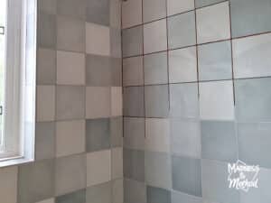 mixed blue tiles with gray grout