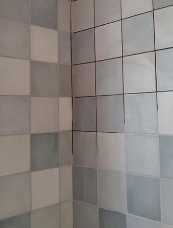 mixed blue tiles with gray grout