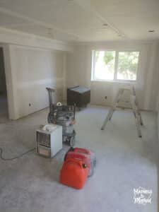 basement with drywall and big windows