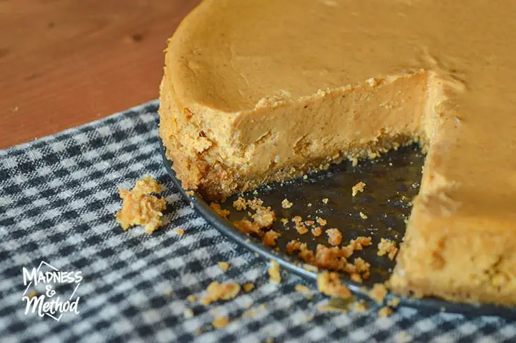pumpkin pie cheesecake with slice missing