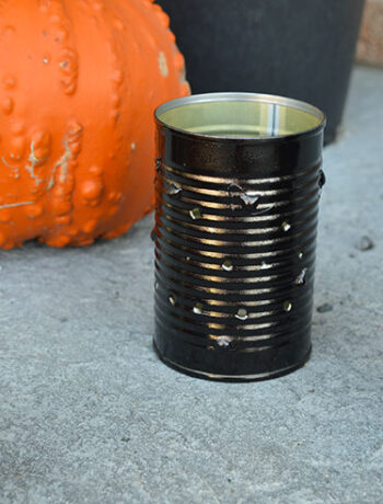 black tin can lantern with pumpkin