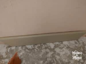 peach microcement and baseboard