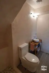 small basement bathroom under stairs