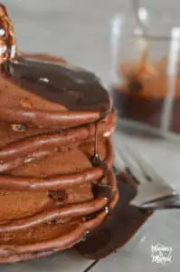 triple chocolate pancakes with drizzled syrup