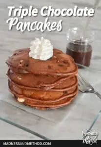 triple chocolate pancakes text overlay with clear plate pancake stack and whipped cream