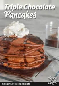 whipped cream on triple chocolate pancakes