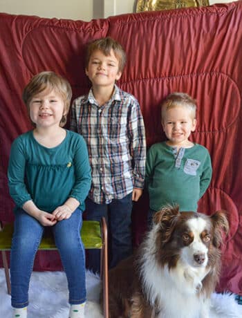 three young kids red background