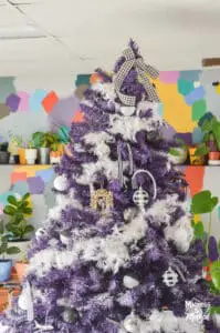 purple christmas tree with colourful background