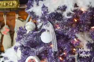 white ornaments and ribbon on tree