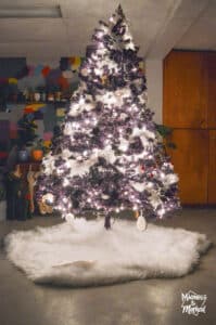 purple black and white christmas tree at night