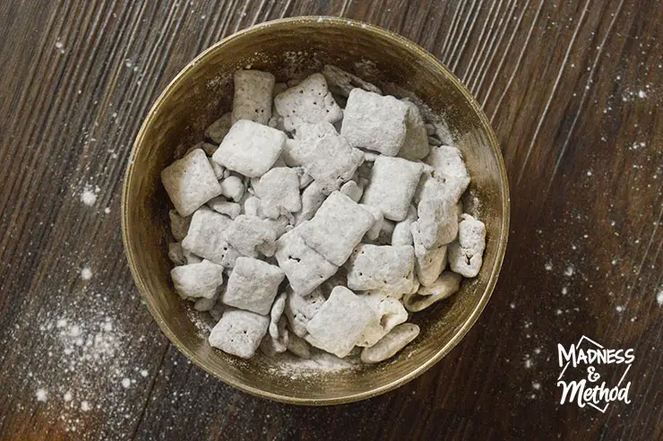 puppy chow in bowl on dark background