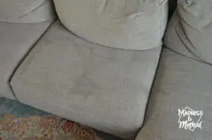 gray sofa cushions with stains