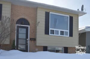 raised ranch facade in winter