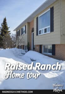 raised ranch house with black shutters