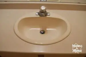 almond sink with old faucet
