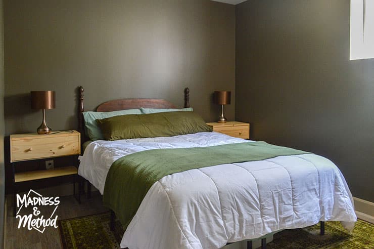 green bedding dark walls