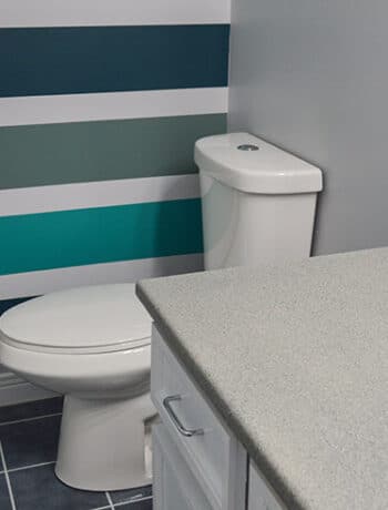 gray counters teal walls bathroom