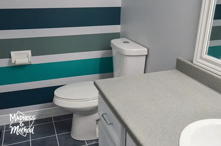 gray counters teal walls bathroom