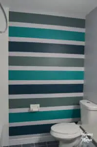 bold teal striped accent wall