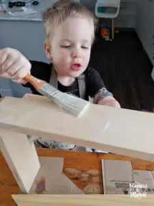 toddler painting wood
