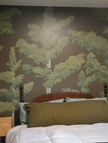 pine tree mural behind bed