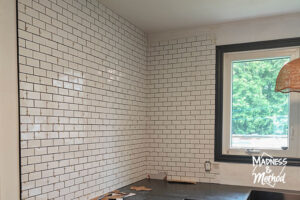 small subway tiles up wall