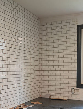 small subway tiles up wall