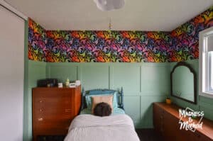 teal wainscoting in bedroom