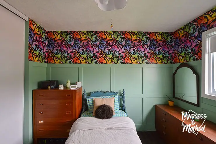 teal wainscoting in bedroom