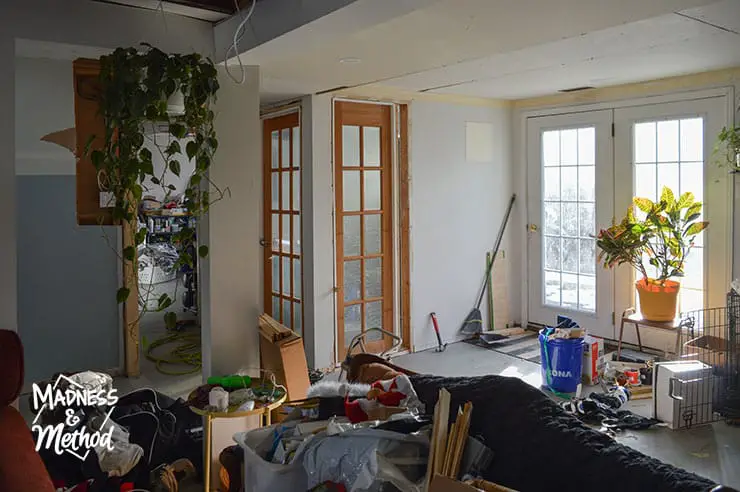 messy basement with glass doors