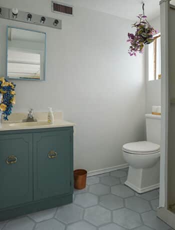 basement bathroom before painted floors teal vanity