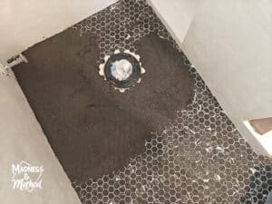 grouting black miniature hexagon tile floors
