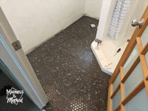 wiping grout from black hex floors