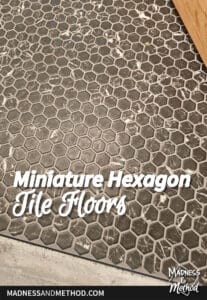 miniature black hexagon tile floors with dark grout