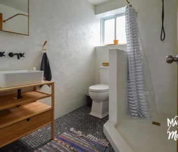 white microcement bathroom with window