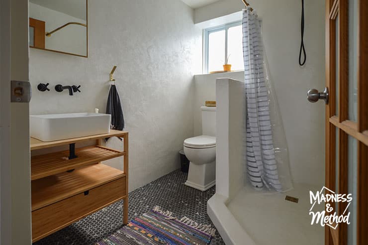 white microcement bathroom with window