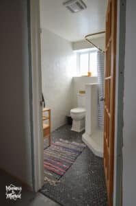 white bathroom with black floors