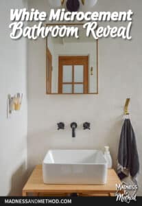 white walls black wall mount faucet and sink