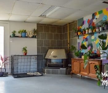 walkout basement with concrete floor and old fireplace