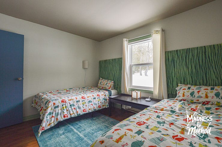 two twin beds with window between